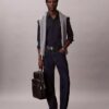 Allover Embossed Emblem Logo Round Backpack