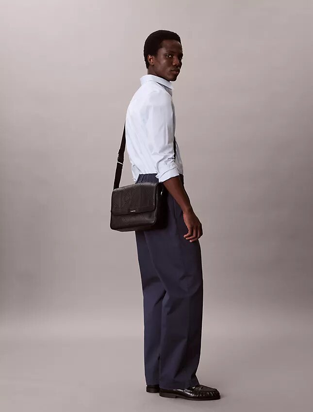 Allover Embossed Emblem Messenger Bag Allover Embossed Emblem Messenger Bag