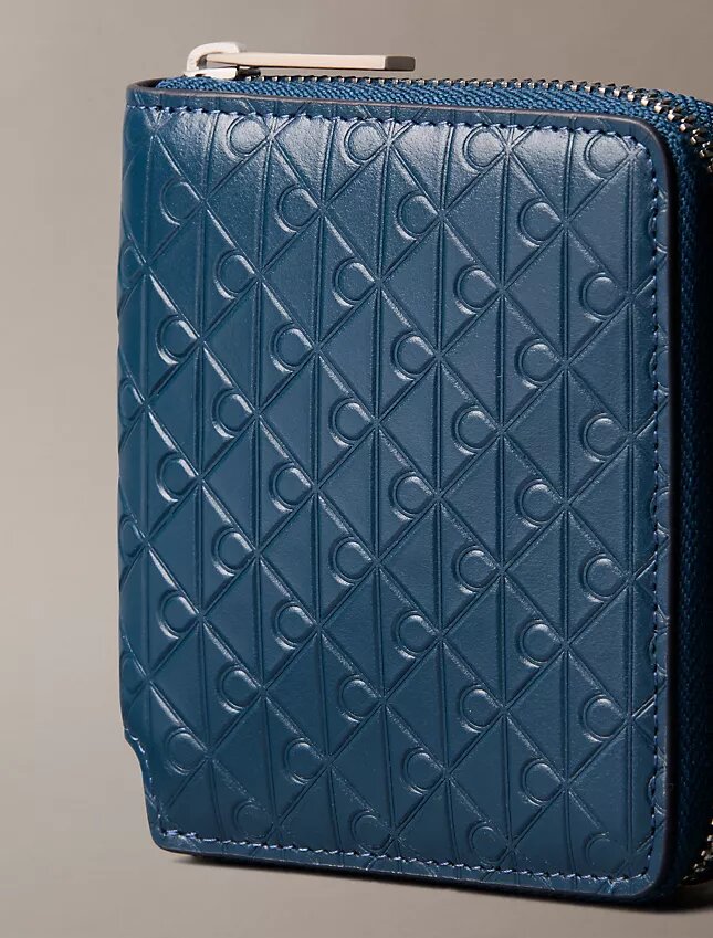 Embossed Allover Emblem Logo Zip Wallet Embossed Allover Emblem Logo Zip Wallet