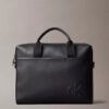 Embossed Monogram Commuter Bag