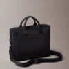 Embossed Monogram Commuter Bag