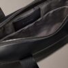 Embossed Monogram Commuter Bag