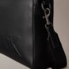 Embossed Monogram Commuter Bag