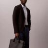 Embossed Monogram Commuter Bag